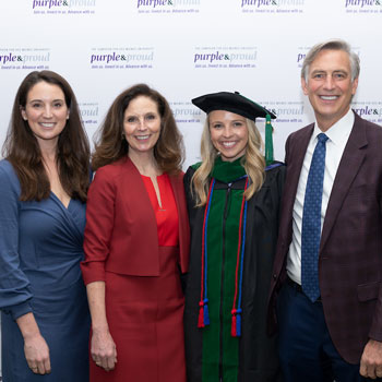 Family smiling with graduate